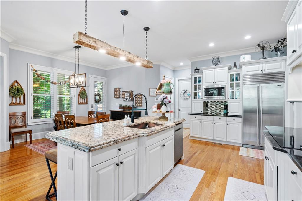 11 York Trace Southeast Cartersville, GA 30121 - Photo 21 of 71 a large kitchen with kitchen island a large counter top space a sink stainless steel appliances and cabinets