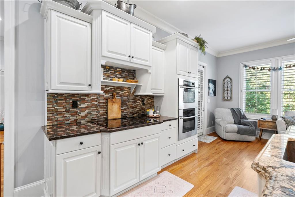11 York Trace Southeast Cartersville, GA 30121 - Photo 22 of 71 a kitchen with stainless steel appliances granite countertop a stove and white cabinets