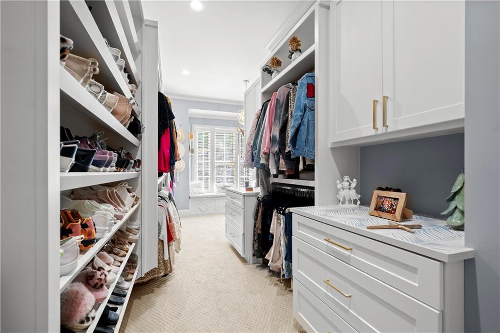 11 York Trace Southeast Cartersville, GA 30121 - Photo 38 of 71 a view of walk in closet with clothes and shoes