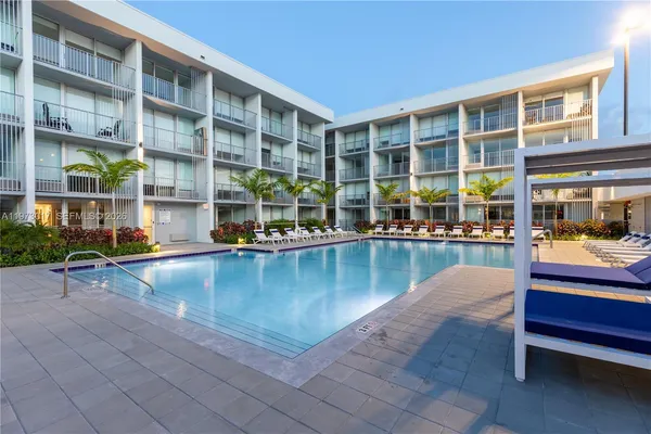 a view of a swimming pool with a lounge chairs