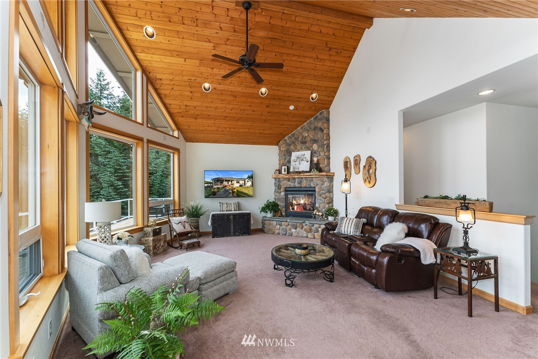 1579 Southwest J H Road Port Orchard, WA 98367 - Photo 11 of 36 a living room with furniture and a large window