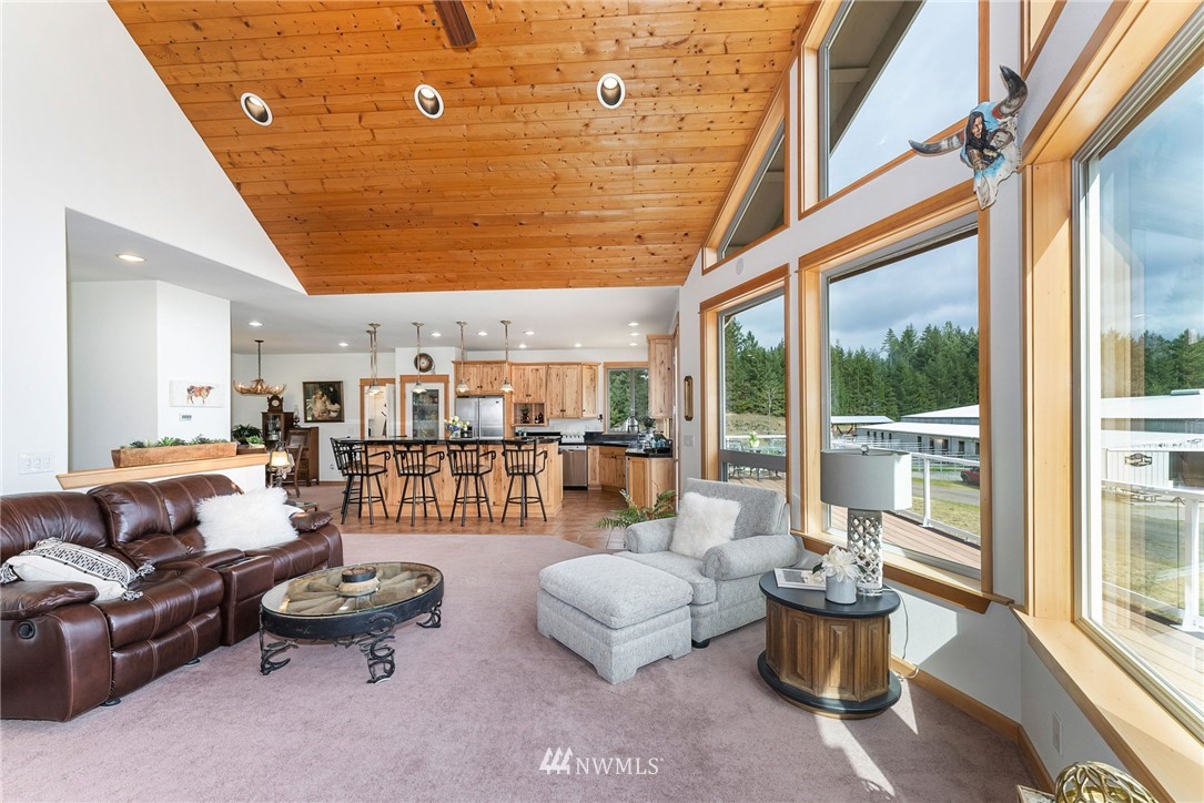 1579 Southwest J H Road Port Orchard, WA 98367 - Photo 12 of 36 a living room with furniture and a potted plant