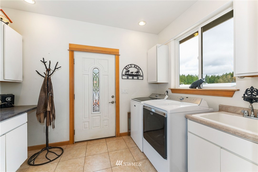 1579 Southwest J H Road Port Orchard, WA 98367 - Photo 18 of 36 a view of a kitchen with fridge and workspace