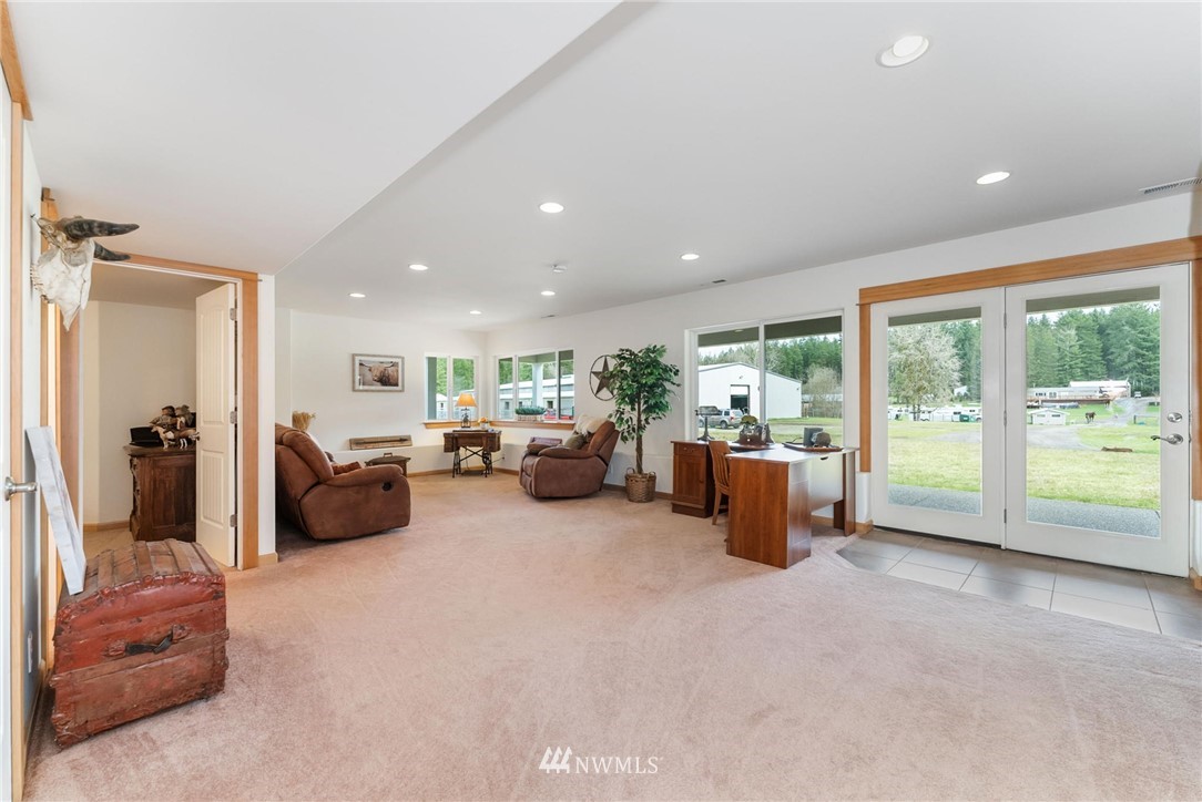 1579 Southwest J H Road Port Orchard, WA 98367 - Photo 19 of 36 a living room with furniture and a large window