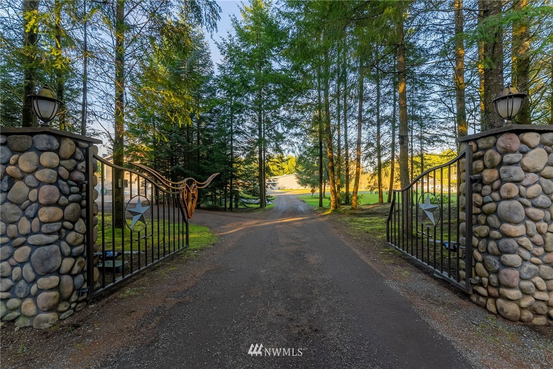 1579 Southwest J H Road Port Orchard, WA 98367 - Photo 2 of 36 a view of street and with trees