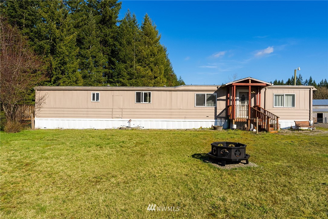 1579 Southwest J H Road Port Orchard, WA 98367 - Photo 22 of 36 a view of a house with a yard