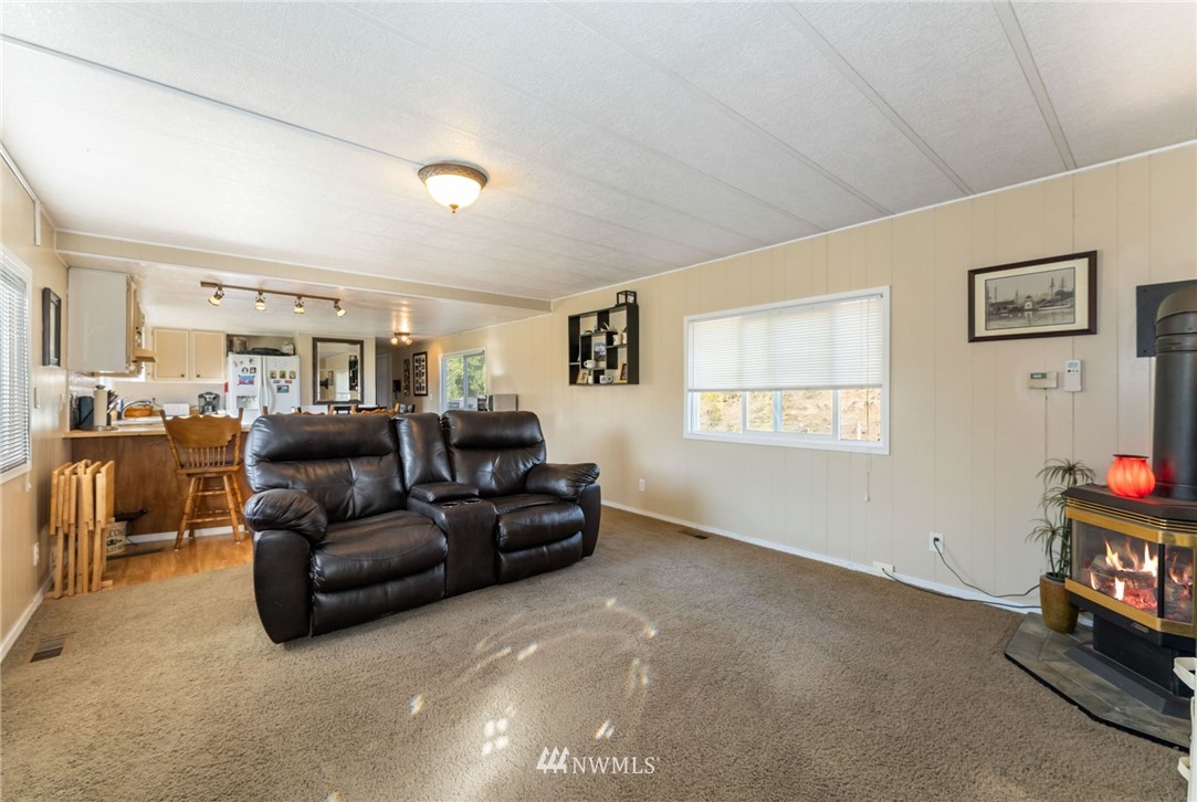 1579 Southwest J H Road Port Orchard, WA 98367 - Photo 24 of 36 a living room with furniture and a window