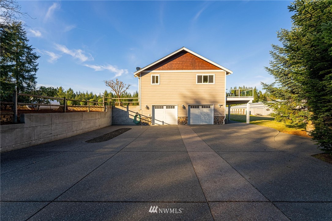 1579 Southwest J H Road Port Orchard, WA 98367 - Photo 28 of 36 a front view of a house with a yard