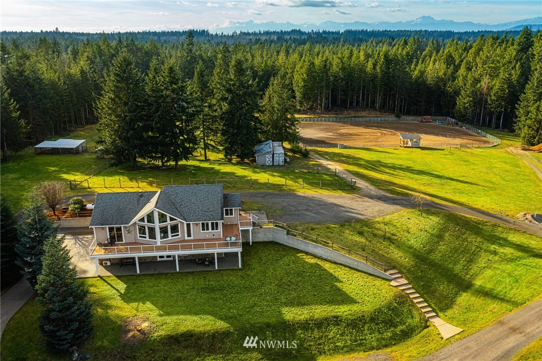 1579 Southwest J H Road Port Orchard, WA 98367 - Photo 29 of 36 a view of a swimming pool with a garden