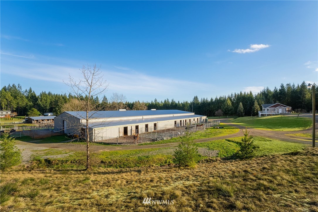 1579 Southwest J H Road Port Orchard, WA 98367 - Photo 30 of 36 a view of a swimming pool with a yard