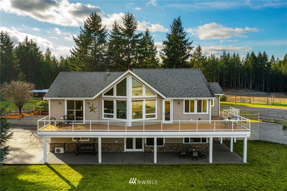 1579 Southwest J H Road Port Orchard, WA 98367 - Photo 3 of 36 a aerial view of a house with swimming pool and porch