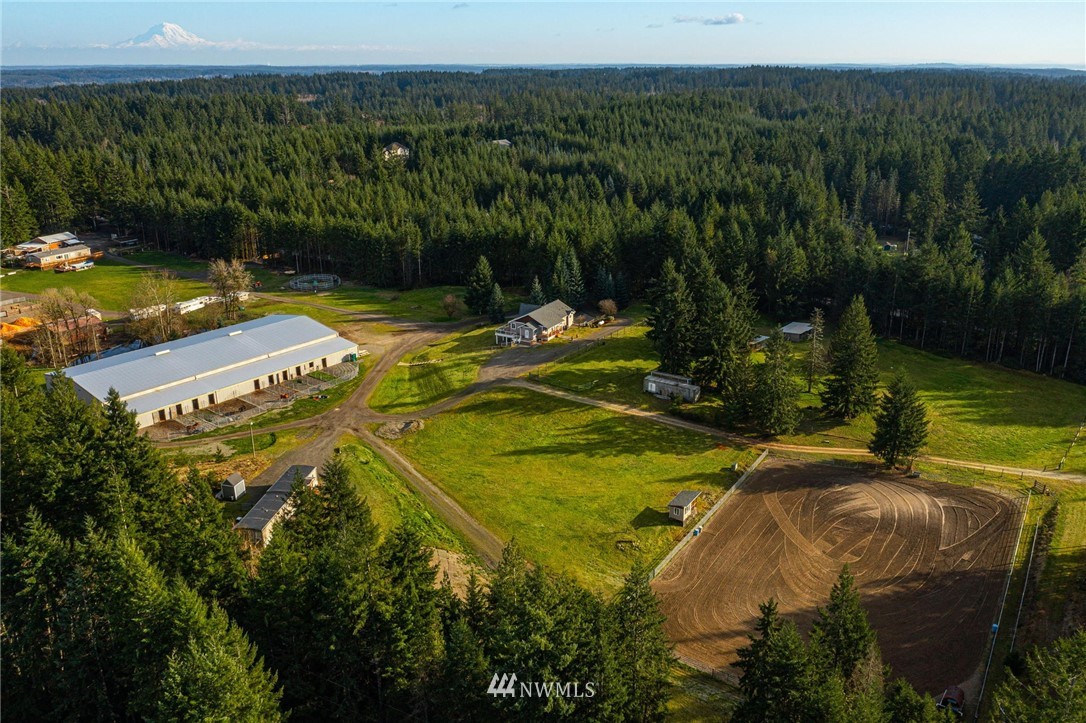 1579 Southwest J H Road Port Orchard, WA 98367 - Photo 32 of 36 a view of a swimming pool with a yard