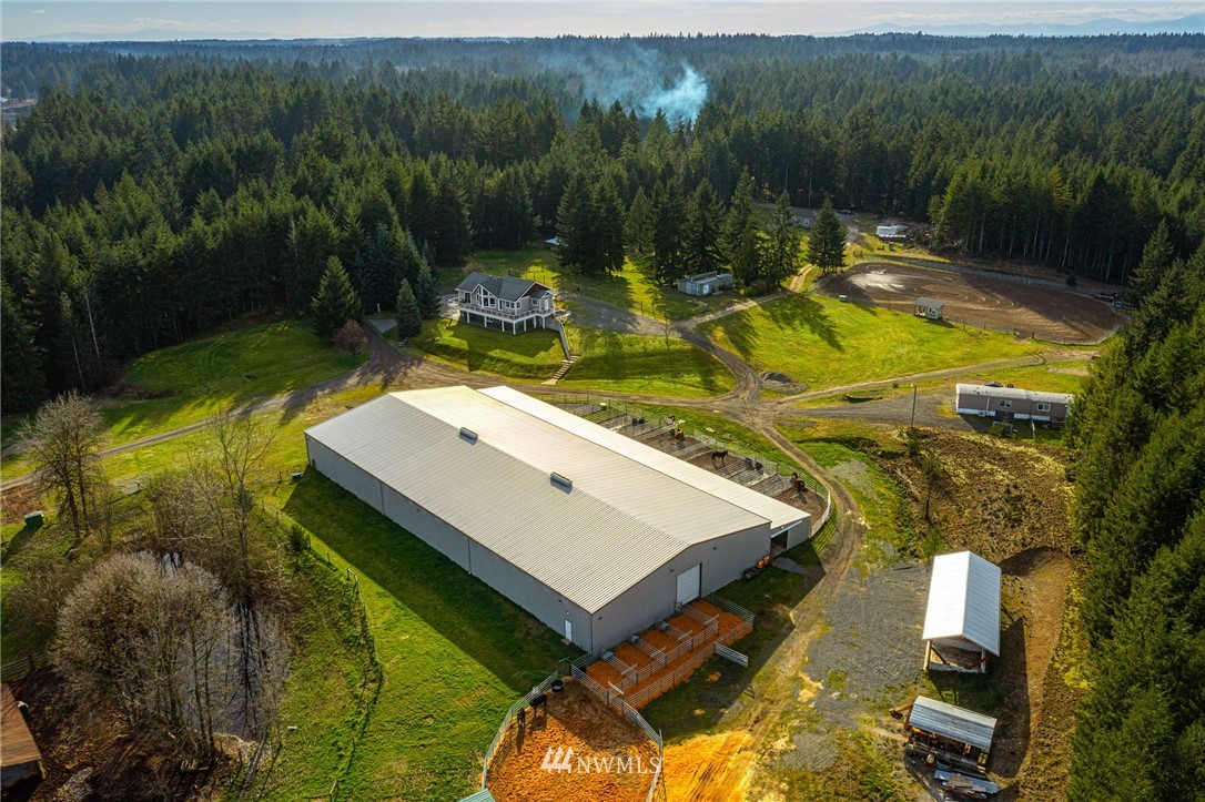 1579 Southwest J H Road Port Orchard, WA 98367 - Photo 5 of 36 a view of a swimming pool with a yard