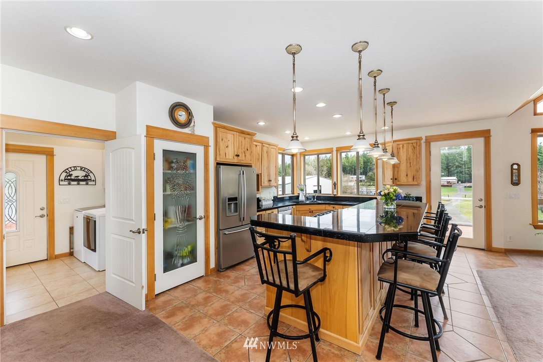 1579 Southwest J H Road Port Orchard, WA 98367 - Photo 6 of 36 a dining area with a table and chairs