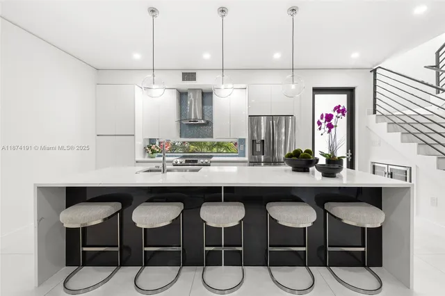 a kitchen with a table and chairs in it