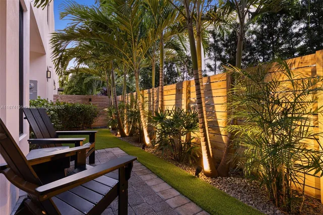 a view of yard with patio