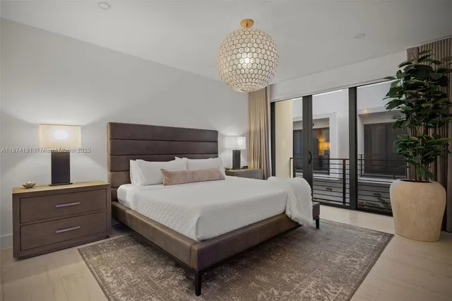 a spacious bedroom with a bed and window