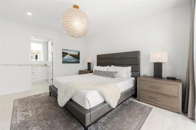 a bathroom with a granite countertop sink a mirror and a shower