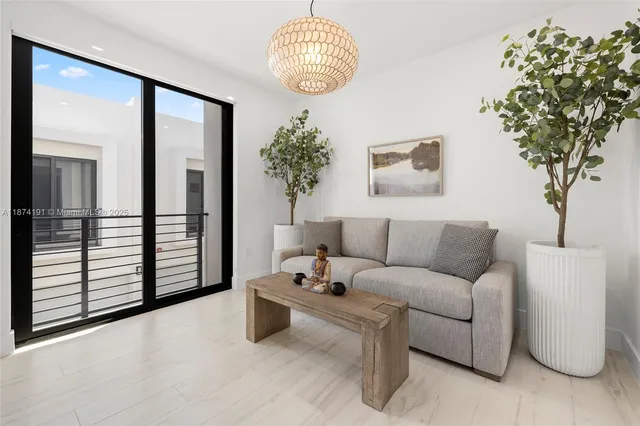 a view of a hallway with a dining room