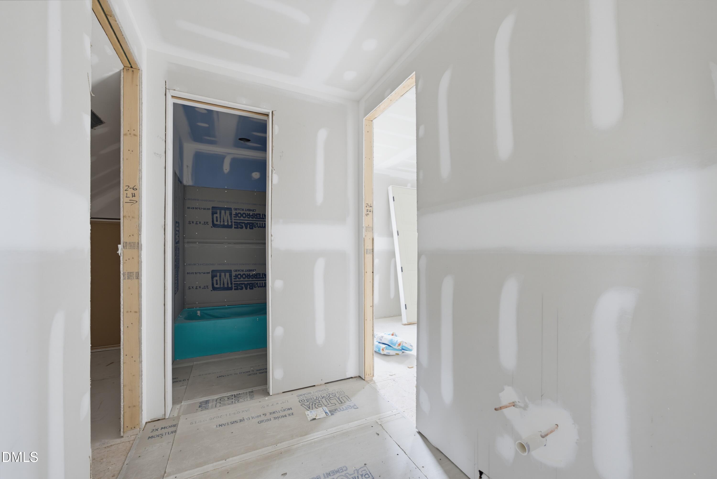7508 Grist Mill Road Raleigh, NC 27615 - Photo 18 of 32 a bathroom with a shower and closet