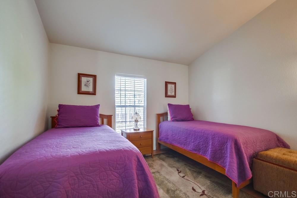 9500 Harritt Road, Unit 106 Lakeside, CA 92040 - Photo 11 of 35 a bedroom with two beds and a window