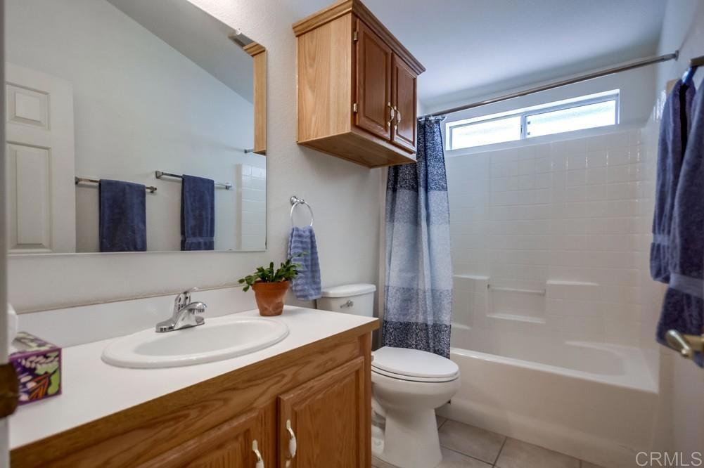 9500 Harritt Road, Unit 106 Lakeside, CA 92040 - Photo 13 of 35 a bathroom with a sink a toilet and shower