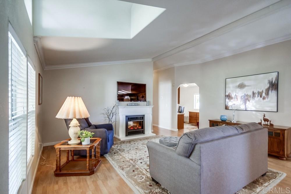 9500 Harritt Road, Unit 106 Lakeside, CA 92040 - Photo 2 of 35 a living room with furniture and a fireplace