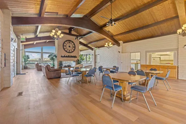 a view of a dinning table and chairs in the patio