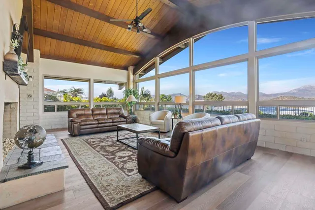 a living room with couch and a large window
