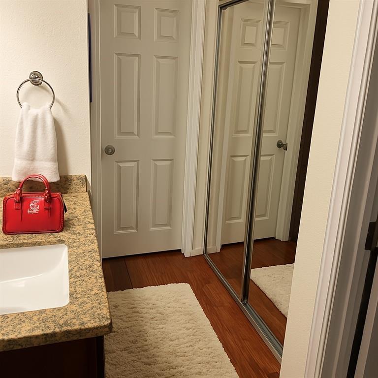 9254 Forest Lane, Unit 304 Dallas, TX 75243 - Photo 13 of 17 a bathroom with a sink and mirror
