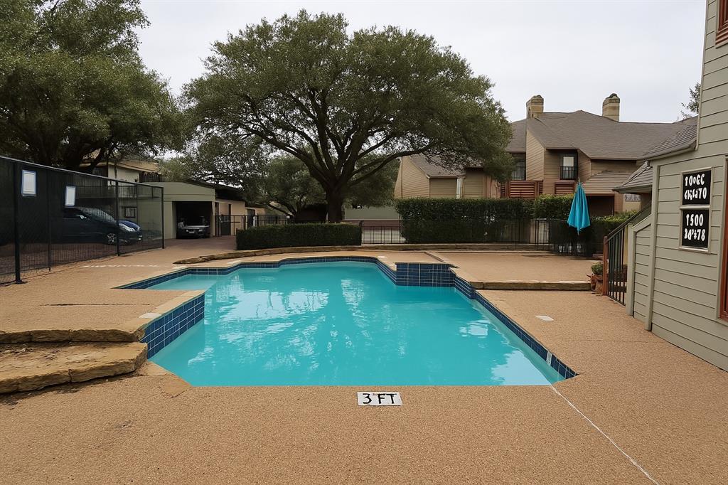 9254 Forest Lane, Unit 304 Dallas, TX 75243 - Photo 17 of 17 a view of a swimming pool with a patio