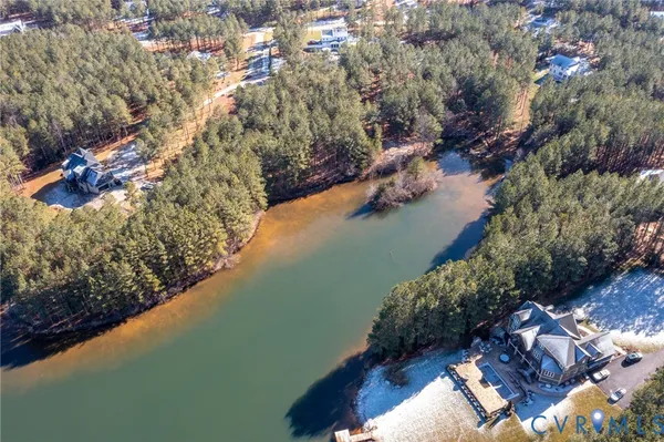 a view of a house with a yard from a balcony