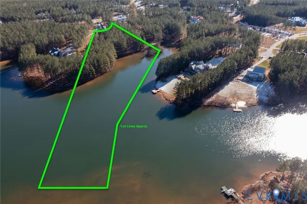 a view of a house with a lake and a mountain view