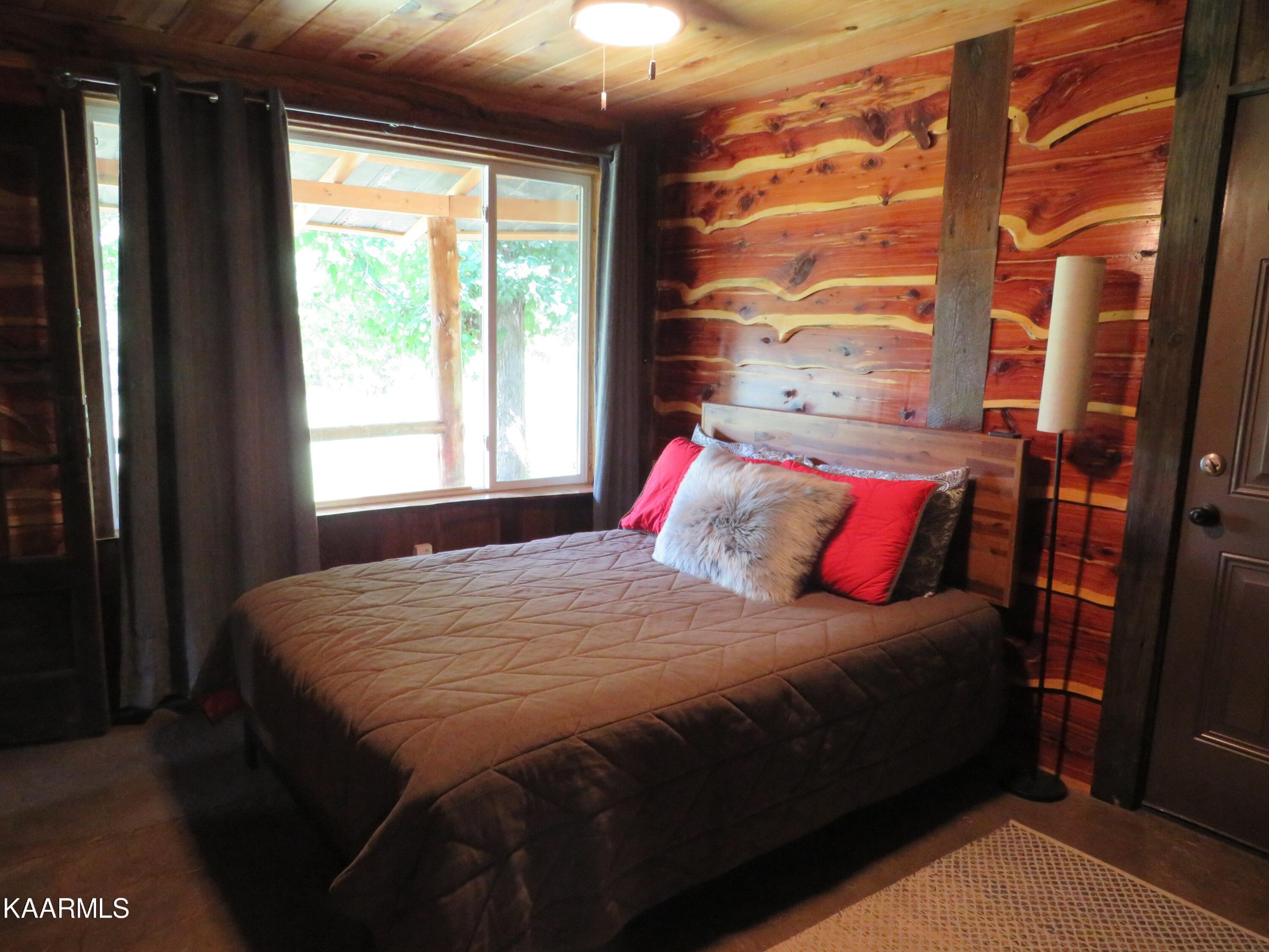 266 Ross Williams Road Lancing, TN 37770 - Photo 18 of 39 a bedroom with a bed and a window