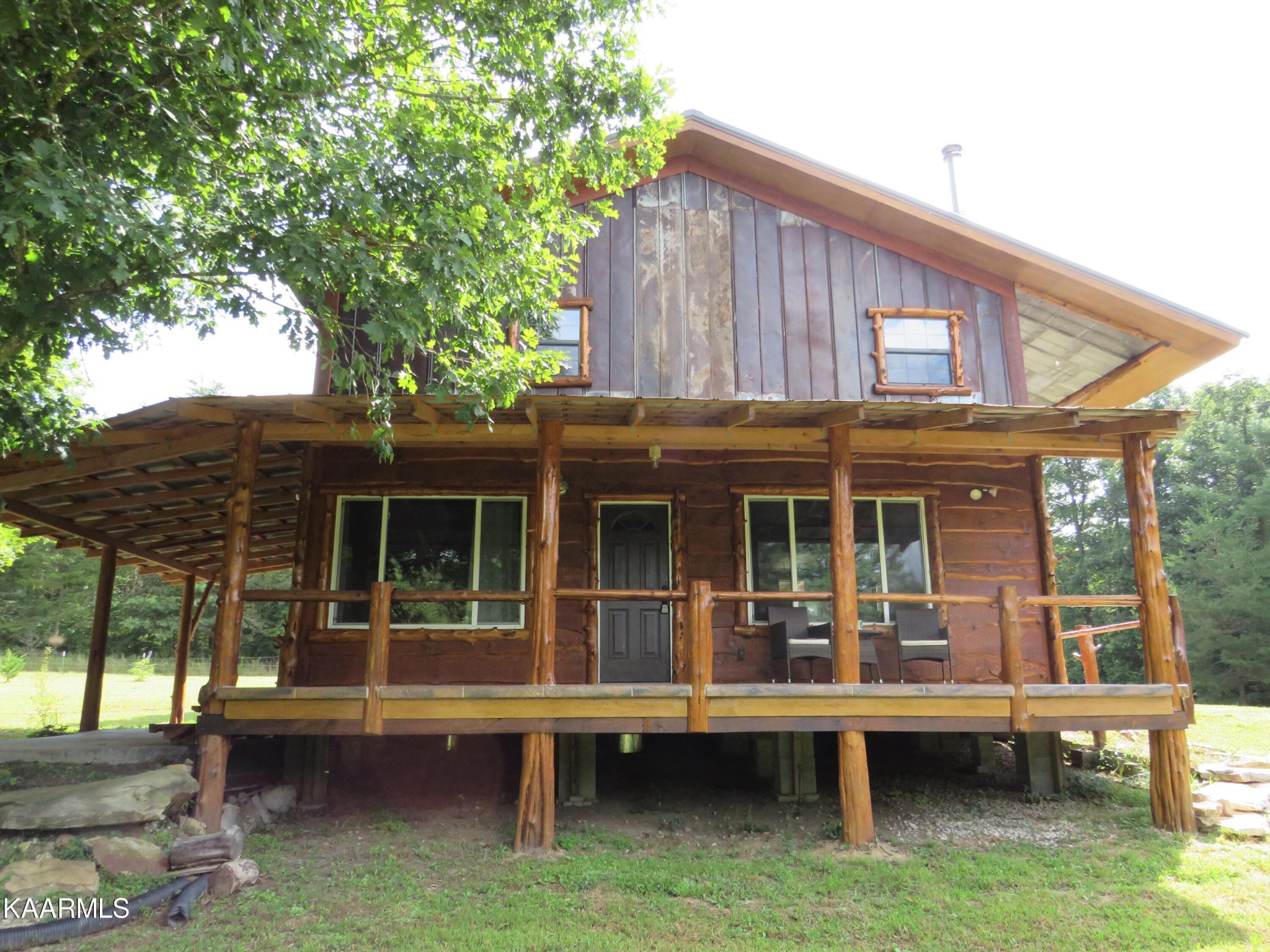 266 Ross Williams Road Lancing, TN 37770 - Photo 25 of 39 a house view with a outdoor seating space