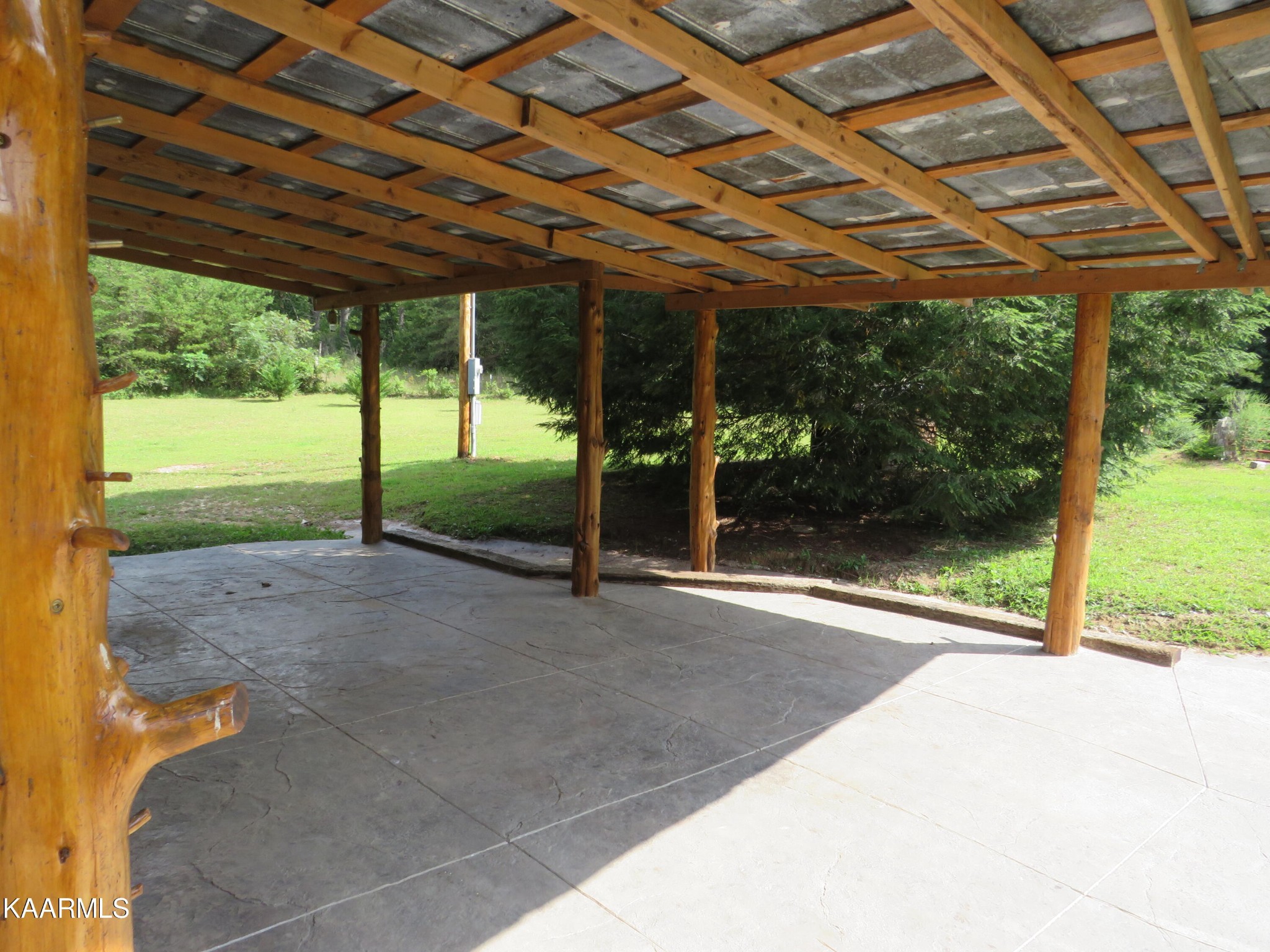 266 Ross Williams Road Lancing, TN 37770 - Photo 28 of 39 a view of a house with backyard and a patio