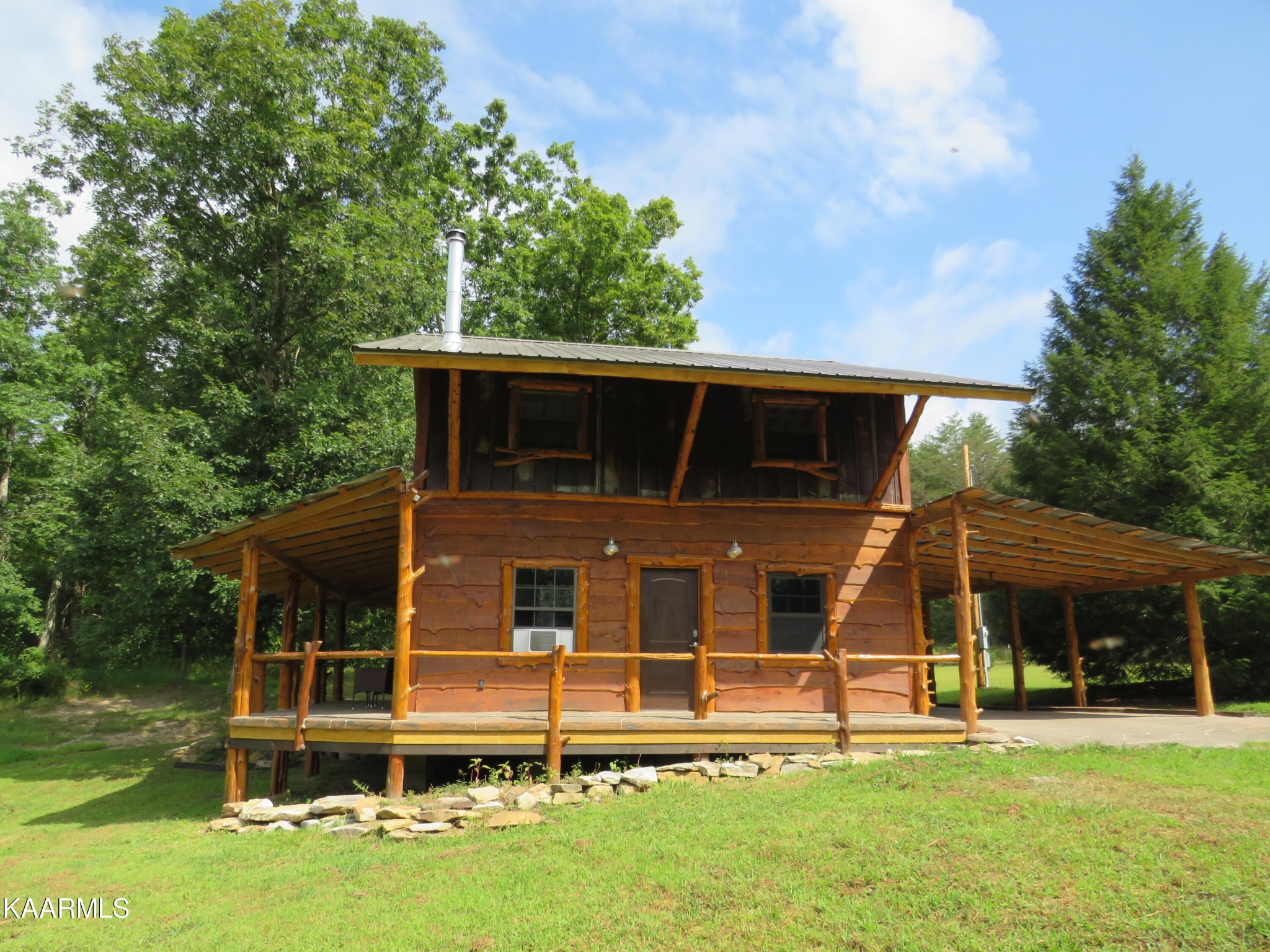 266 Ross Williams Road Lancing, TN 37770 - Photo 29 of 39 front view of a house with a yard