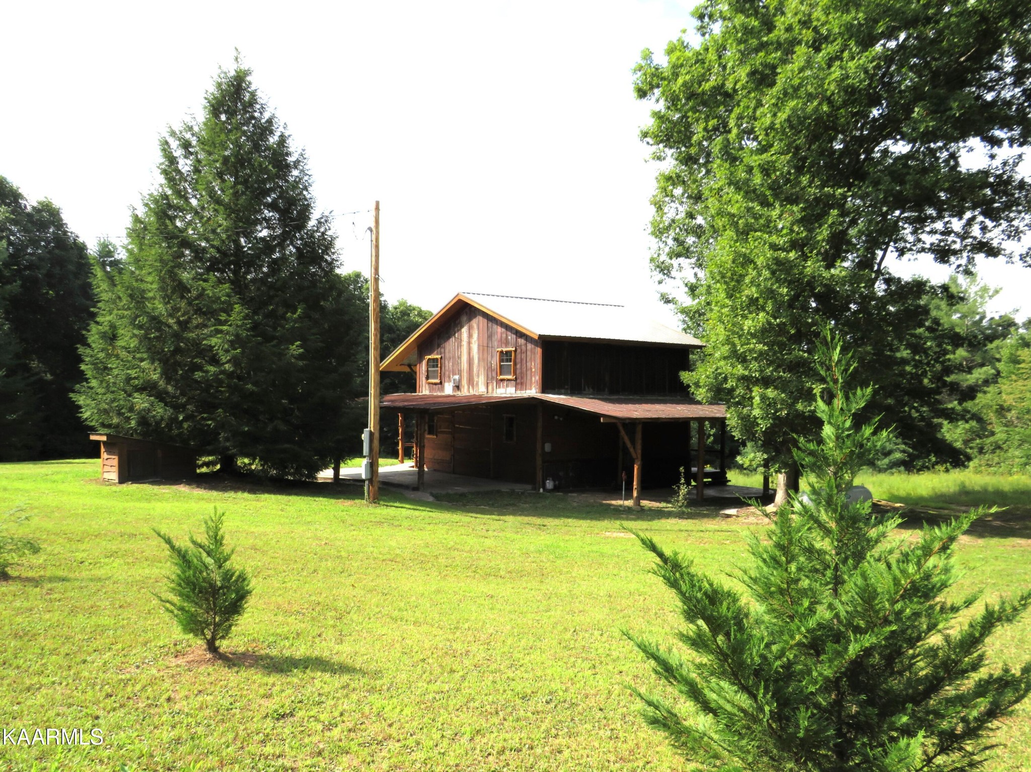 266 Ross Williams Road Lancing, TN 37770 - Photo 39 of 39 a view of house with yard and swimming pool