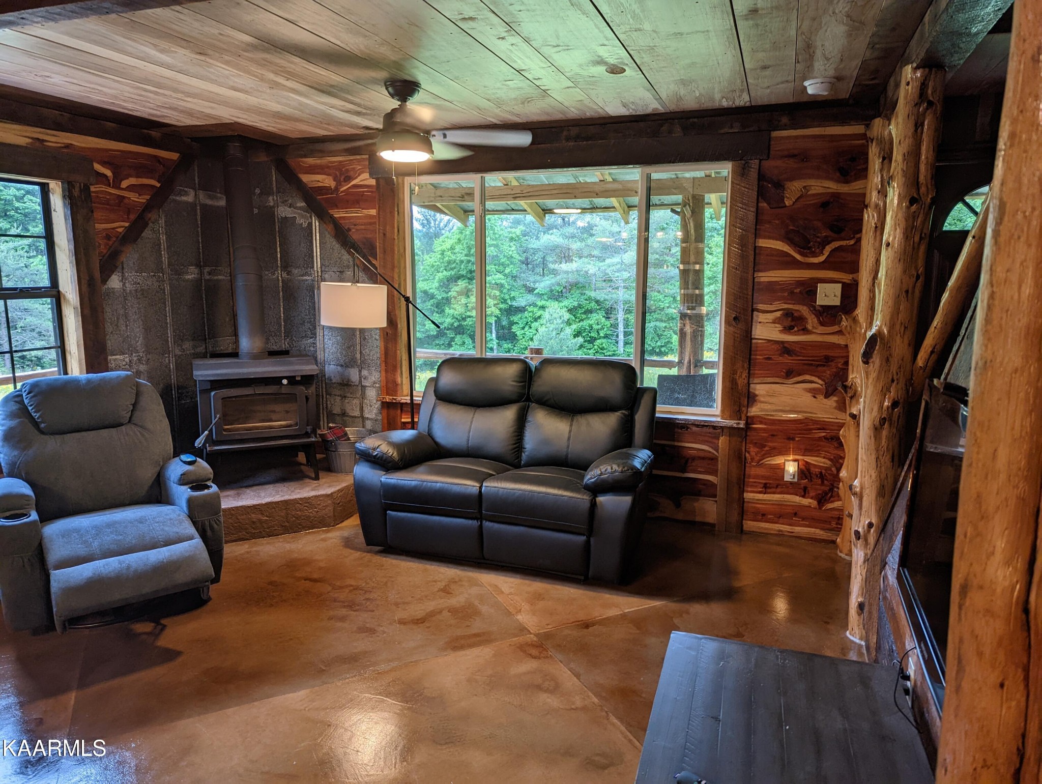 266 Ross Williams Road Lancing, TN 37770 - Photo 6 of 39 a living room with furniture a ceiling fan and a window
