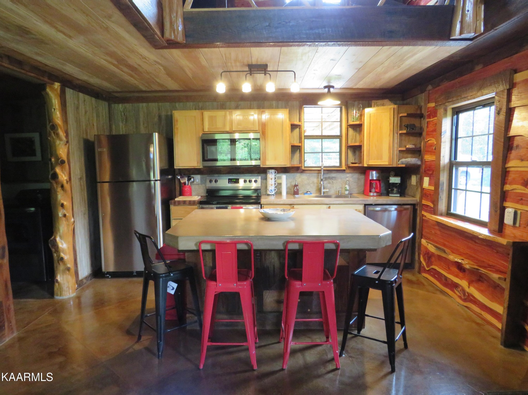 266 Ross Williams Road Lancing, TN 37770 - Photo 10 of 39 a view of a dining room with furniture window and wooden floor