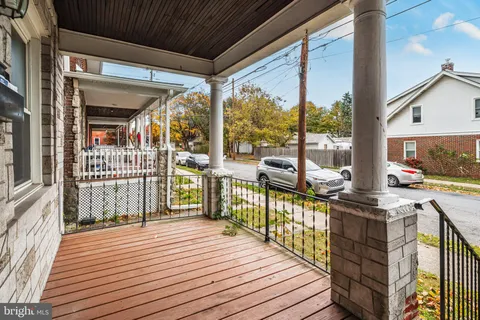a view of a balcony with wooden floor