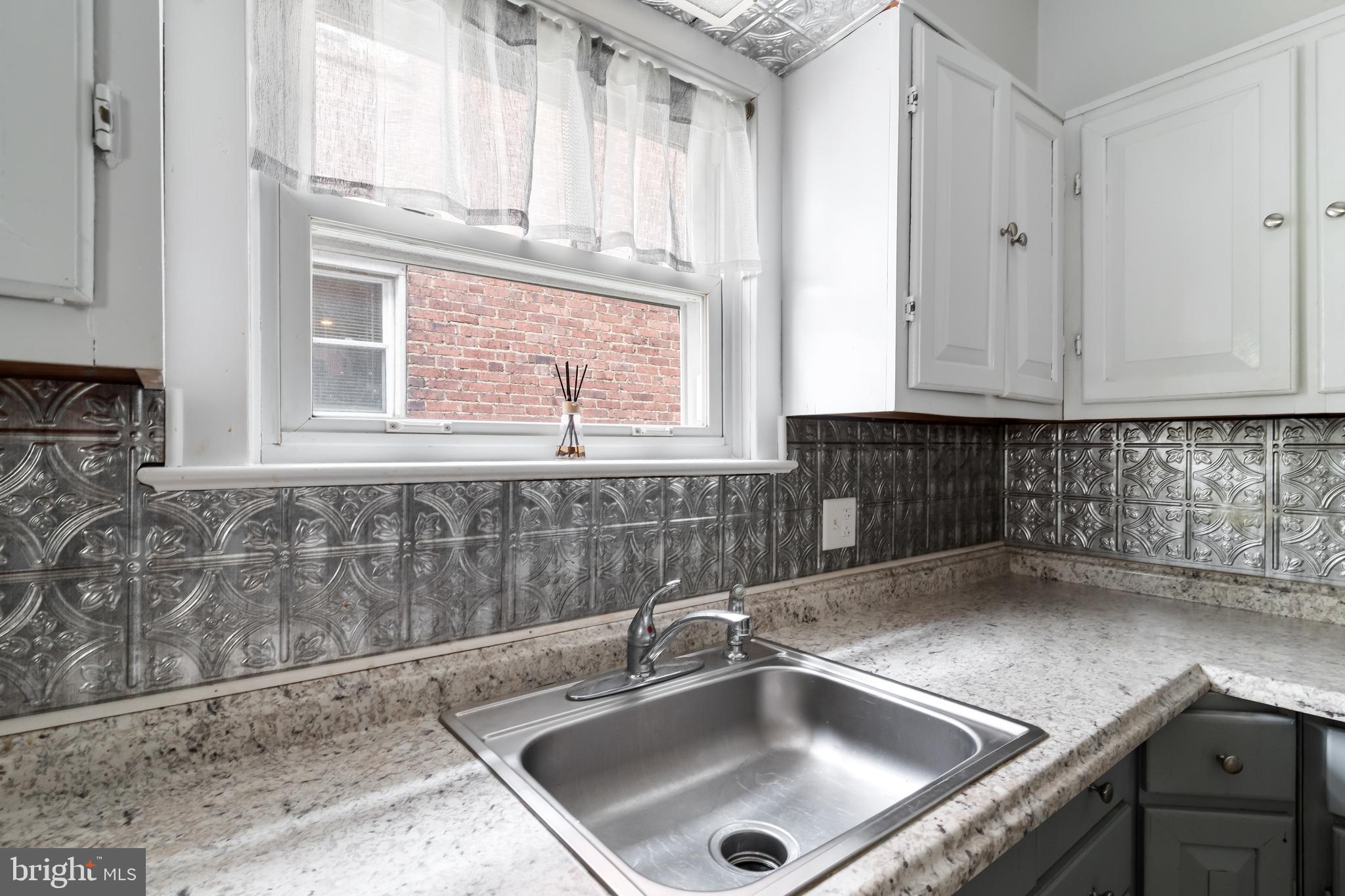 422 Hickory Street Bethlehem, PA 18017 - Photo 24 of 40 a kitchen with a sink and cabinets