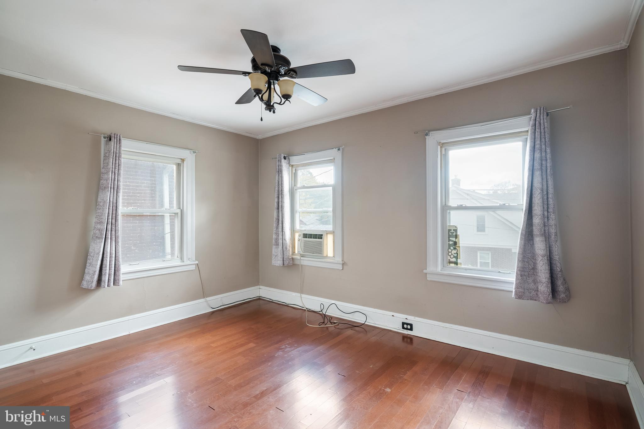 422 Hickory Street Bethlehem, PA 18017 - Photo 30 of 40 a view of an empty room with wooden floor and a window