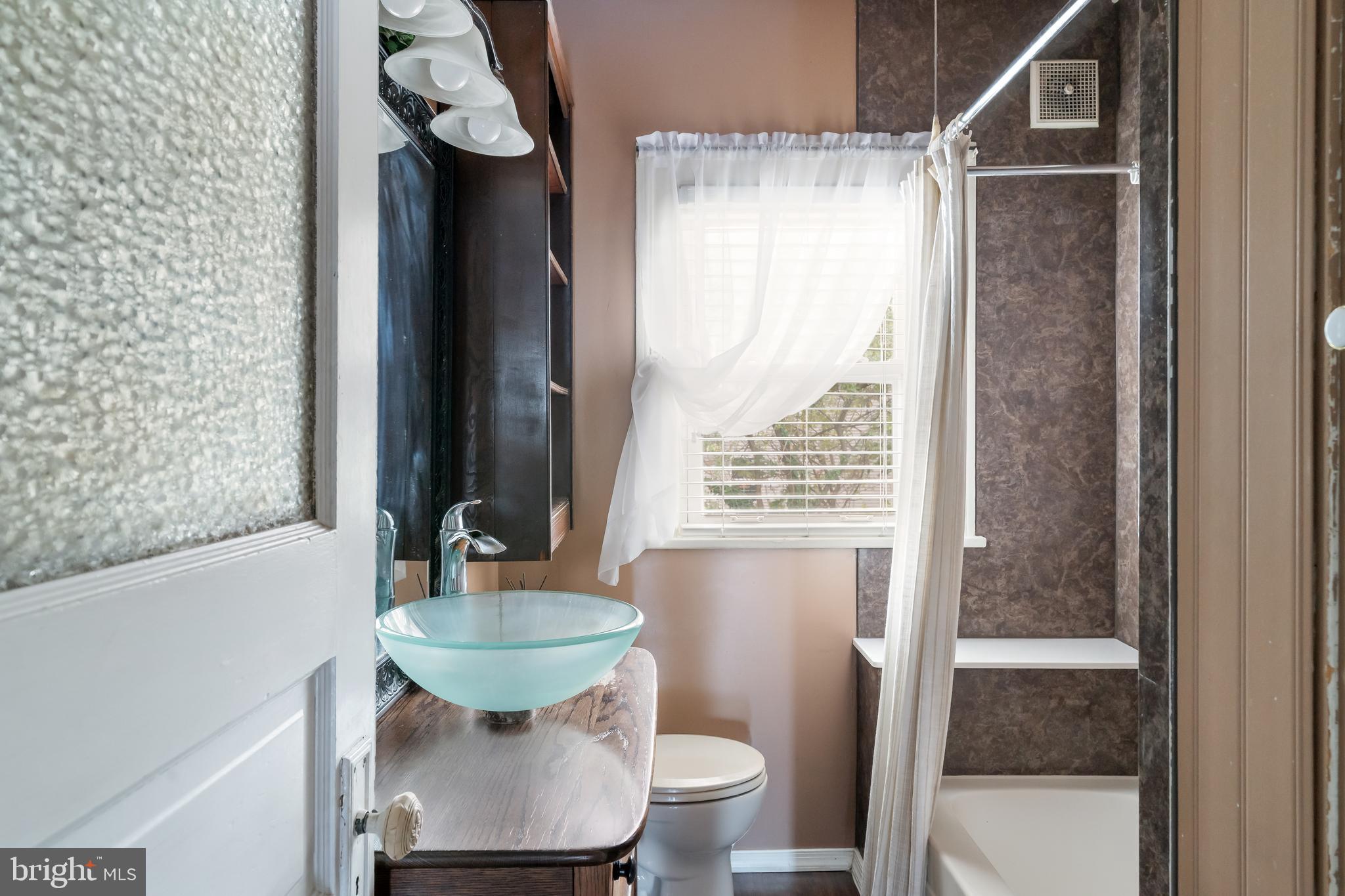 422 Hickory Street Bethlehem, PA 18017 - Photo 35 of 40 a bathroom with a sink and a mirror