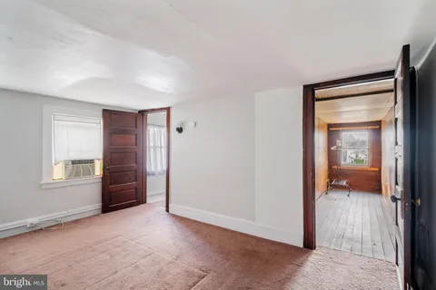 a view of gallery with wooden floor