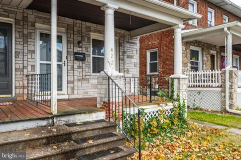 a view of a brick house with many windows