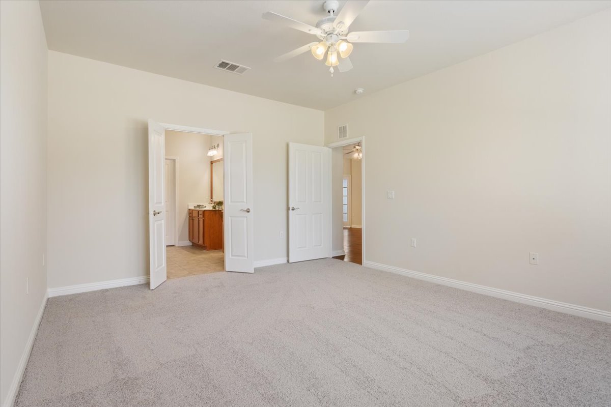 108 Cathedral Mountain Pass Georgetown, TX 78633 - Photo 20 of 36 an empty room with a bathroom and a shower