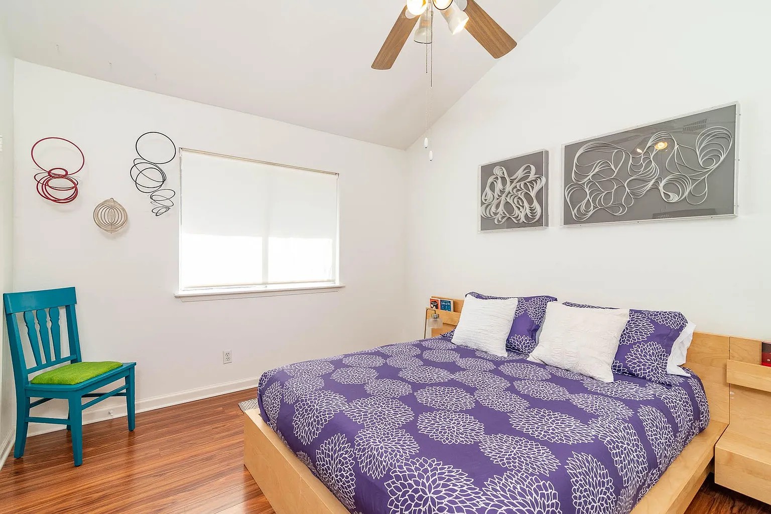 5405 Brompton Circle, Unit B Austin, TX 78745 - Photo 16 of 19 Bedroom with wood finished floors, vaulted ceiling, and ceiling fan