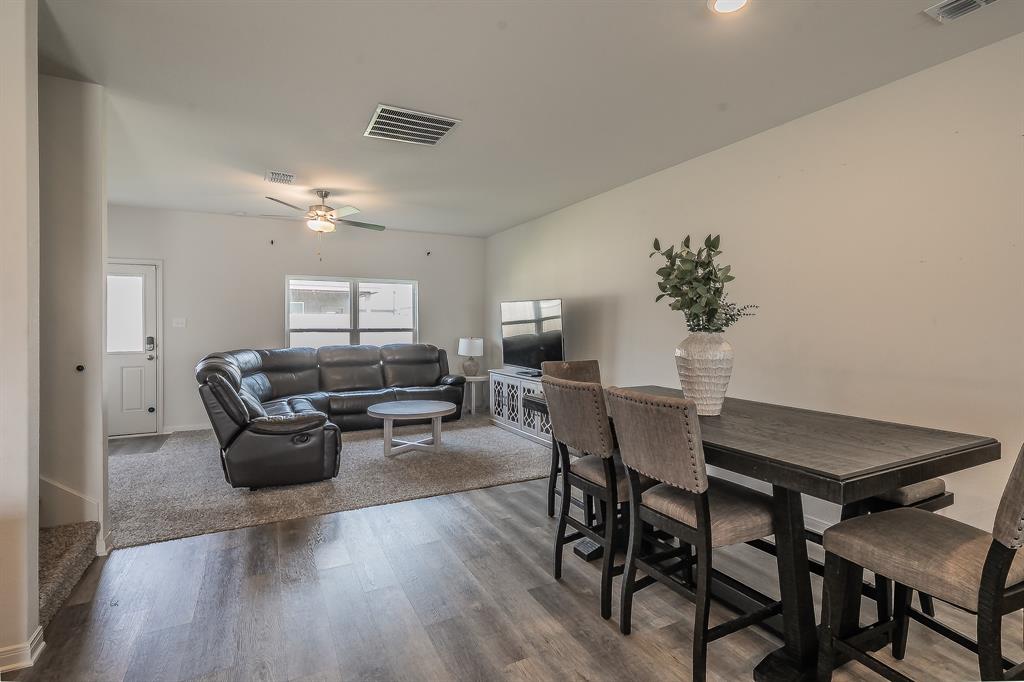 8125 White Sulphur Road Ponder, TX 76259 - Photo 5 of 38 Open-concept living space featuring wood-finish flooring, recessed lighting, a ceiling fan, and carpeted living area