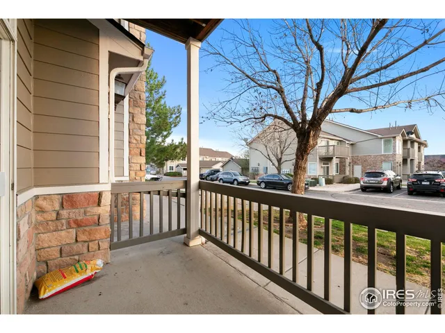 a view of a porch with a floor to ceiling window